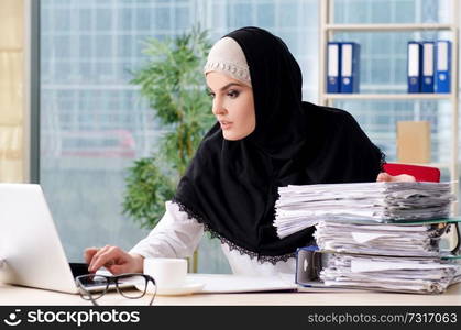 Woman muslim employee working in the office 