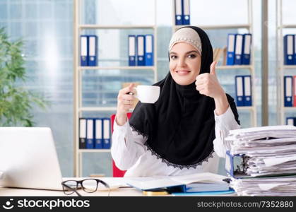 Woman muslim employee working in the office 