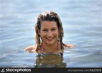 Woman neck-deep in water