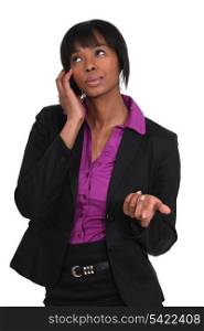 Woman negotiating via mobile telephone