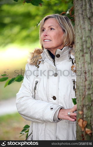 woman next to a tree