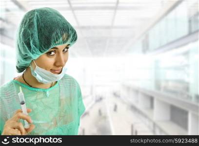 woman nurse portrait with a syringe at the hospital