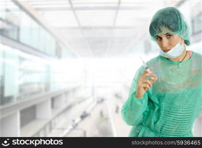 woman nurse portrait with a syringe at the hospital