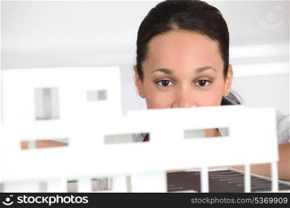 Woman observing architect plan