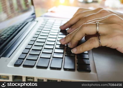 Woman office worker typing on the keyboard