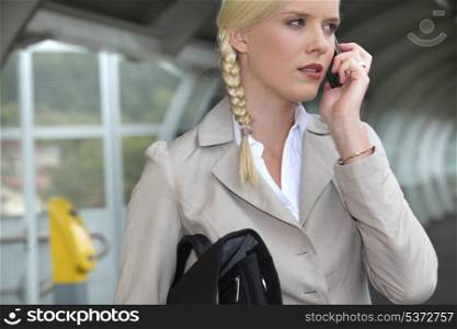 woman on a business travel talking on her cell phone