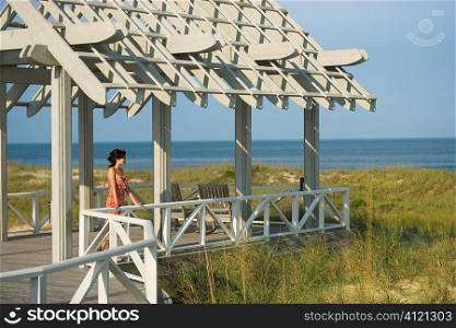 Woman On Arbor Looking at Sea