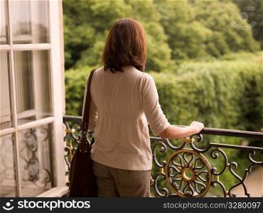 Woman on balcony in Paris France