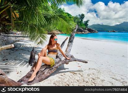 Woman on beach Anse Soleil at Seychelles, Mahe