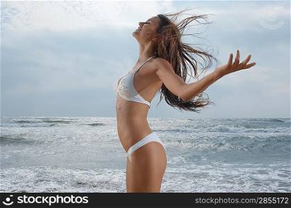 Woman on Beach Enjoying the Breeze