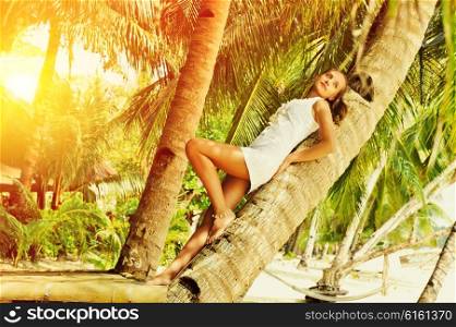 Woman on beautiful beach with palm trees at Philippines