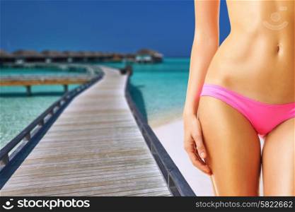 Woman on beautiful beach with water bungalows at Maldives. Collage.