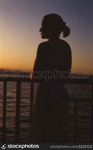 Woman on Boat at Sunset