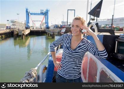 woman on boat using a phone