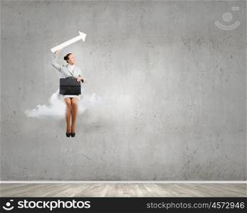 Woman on cloud. Young pretty businesswoman with suitcase sitting on cloud