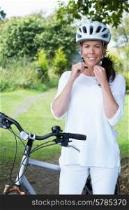 Woman On Cycle Ride In Countryside