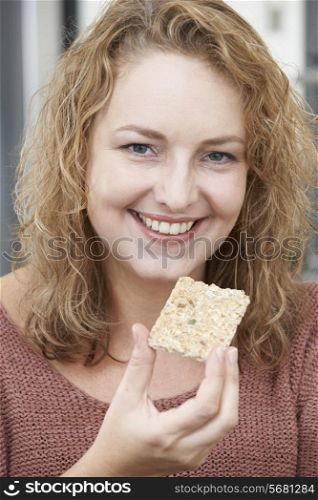 Woman On Diet Eating Crispbread At Home