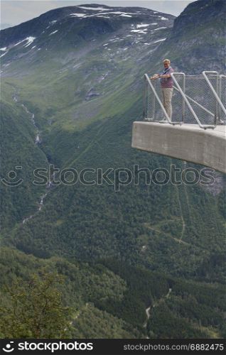 woman on famous viewpoint utiskten near Balestrand in norway