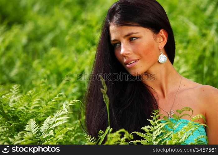 woman on flower field close portrait
