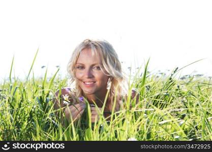 woman on green grass close up