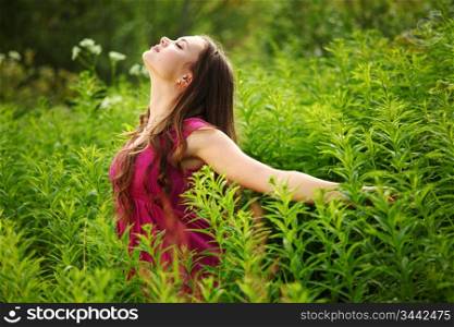 woman on green grass field close portrait