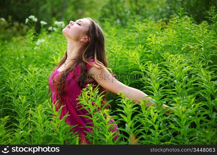 woman on green grass field close portrait