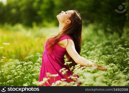 woman on green grass field feel freedom