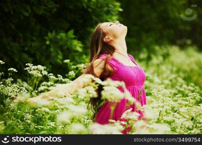 woman on green grass field feel freedom