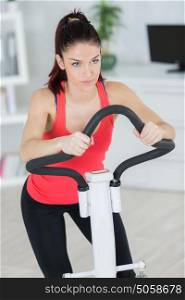 Woman on indoor exercise machine