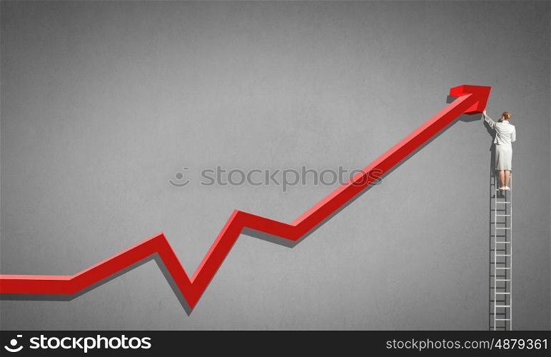 Woman on ladder top. Rear view of businesswoman standing on ladder and drawing graph