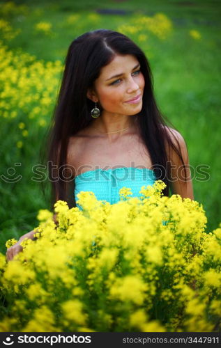 woman on oilseed field close portrait