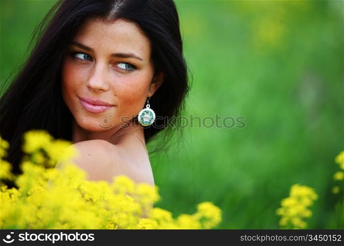 woman on oilseed field close portrait