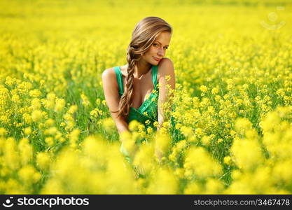 woman on oilseed field close portrait