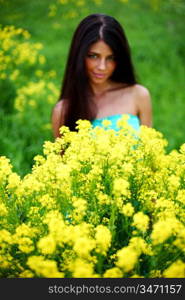 woman on oilseed field close portrait