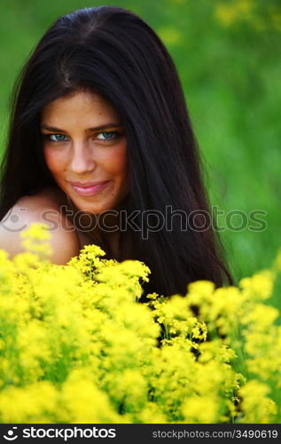 woman on oilseed field close portrait