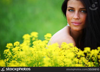 woman on oilseed field close portrait