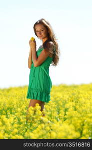 woman on oilseed field close portrait