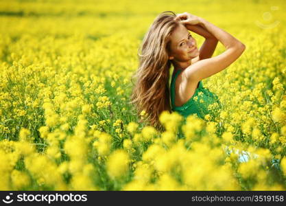 woman on oilseed field close portrait