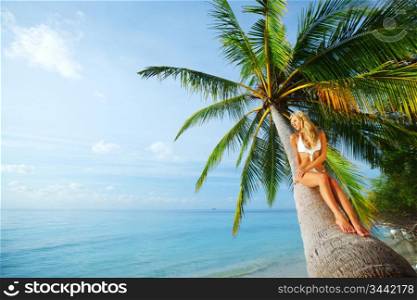 woman on palm sea on backgroud