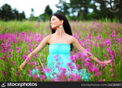 woman on pink flower field close portrait