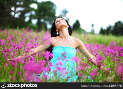 woman on pink flower field close portrait