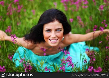 woman on pink flower field close portrait
