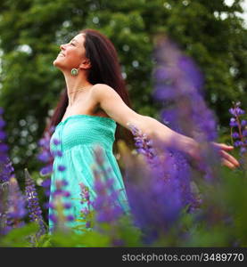 woman on pink flower field close portrait