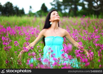 woman on pink flower field close portrait