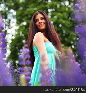 woman on pink flower field close portrait