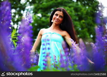 woman on pink flower field close portrait