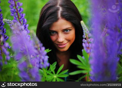 woman on pink flower field close portrait