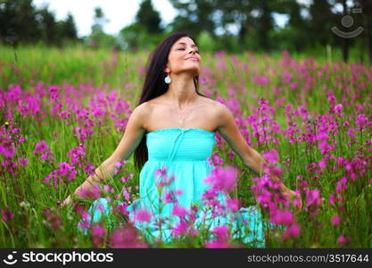 woman on pink flower field close portrait