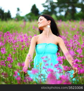 woman on pink flower field close portrait