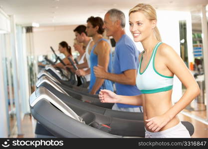 Woman On Running Machine In Gym